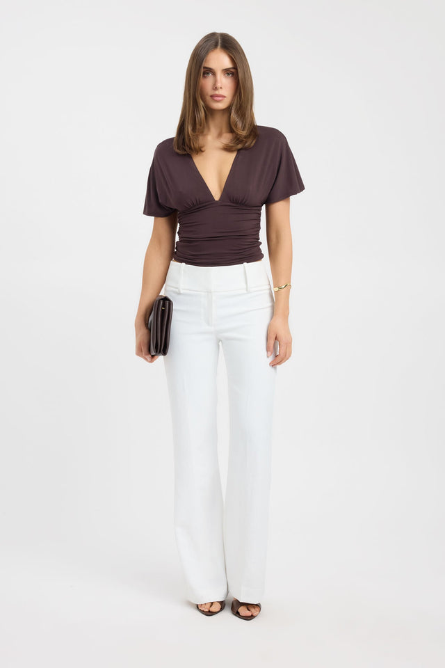 Showcasing the Isla Top womens blouse in brown with fitted v-neck and short sleeves front