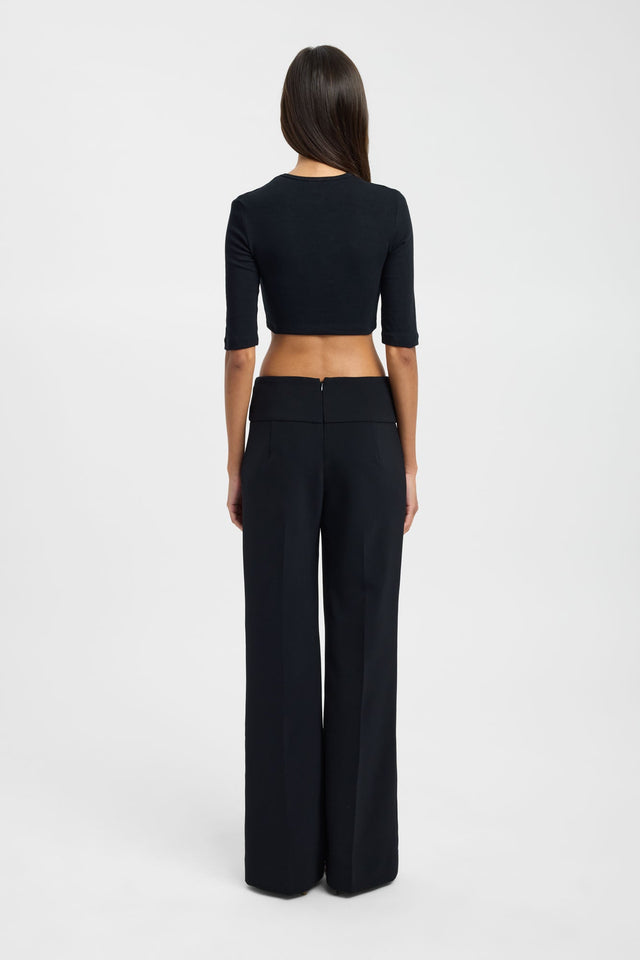 Highlighting the Nancy Crop womens blouse in black with fitted silhouette and round neckline featuring three-fourth sleeves back